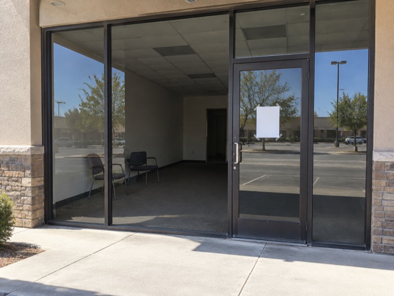 An empty, closed storefront office